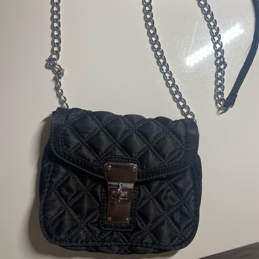 Black purse with silver chain.